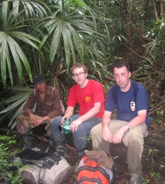 Sitting on a log taking a break with fellow traveller and guatemalan guide